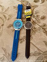 Front view of both watches showing dials and straps