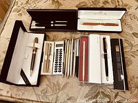 Overview of boxed and loose pens