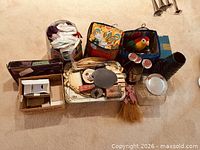 Overall view of lot contents arranged on carpet