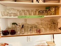 Both shelves showing majority of glassware assortment
