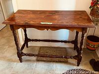 Angled view of entire table showing top surface, legs, and stretcher