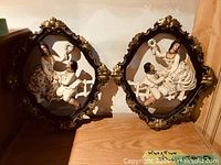 Both chalkware plaques side by side showing overall design and condition