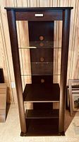 Full view of Bell'Oggetti stereo stand showing frame, shelves, and drawer pull