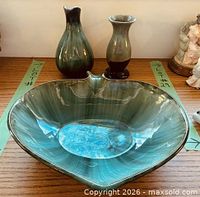 Three pieces displayed together on tabletop