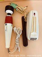 Both massagers with cords and attachment displayed