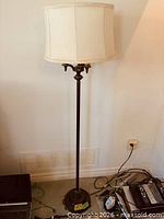 Full view of floor lamp with shade