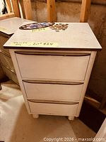 Front and side view of entire cabinet showing three drawers and overall condition