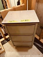 Front view showing full cabinet and three drawers