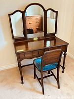 Full view of vanity with mirror and chair