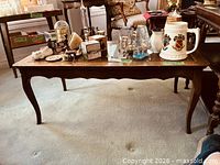 Full view of rectangular wooden coffee table top and legs