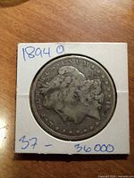 Obverse of 1894-O Morgan dollar in 2×2 flip