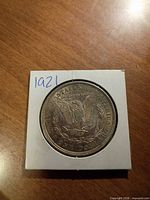 Reverse of 1921 Morgan dollar showing eagle and denomination