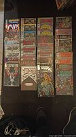 Three columns of bagged Image/Valiant comics laid out, roughly 30+ issues visible