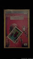 Front of sealed comic showing title banner, Michael Jordan cover art and trading card