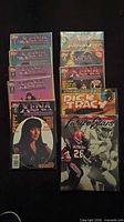 Stack showing five Xena comics and three other Topps publications bagged and boarded
