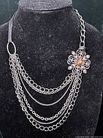 Full view of layered necklace displayed on bust