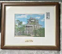 Full view of framed embroidered artwork