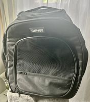 Front view showing OKMEE logo, large mesh door, overall shape