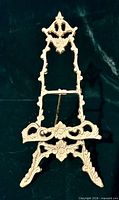 Full view of ornate gold-tone brass mini easel stand