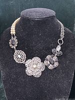 Full necklace displayed on bust showing overall design