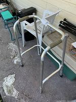 Full view of aluminum walker from side and front angles