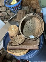 Group of wicker baskets and trays stacked together