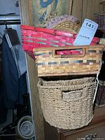 Stack of four baskets showing size range and materials