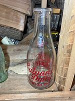 Full view of bottle front showing shape and graphics