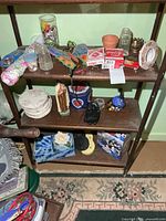 Full view of three lower shelves with assorted collectibles