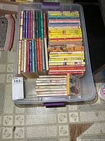 Top view of bin showing multiple rows of paperback Nancy Drew books