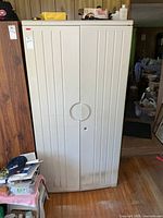 Front view of Rubbermaid storage cabinet showing overall design and condition