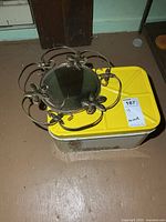 Tin box and mirror together for size reference
