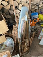 Both folded boards leaning together showing covers and wooden frames