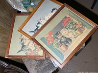 All three framed cat prints stacked