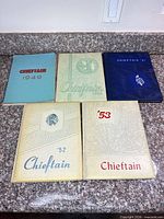 Five yearbooks front covers visible