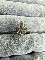 Front view of ring showing cluster of rhinestones