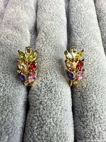 Front view of both earrings showing stone colours and leaf design