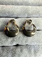 Front view of both crescent clip-on earrings