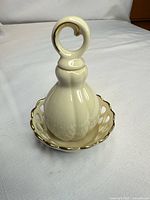 Assembled ring holder showing bell-shaped top seated in dish