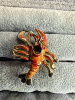 Front view showing enamel colors and missing center stone setting