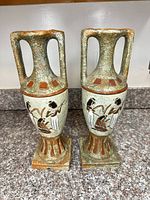 Front view of both Ardo ceramic vases showing Egyptian designs and overall form