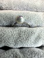 Front view of ring showing pearl and setting