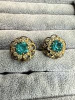 Both earrings front view showing design and stones