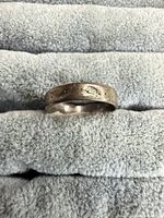 front view of engraved band ring