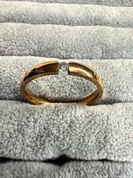 Ring front view showing stone and tension setting