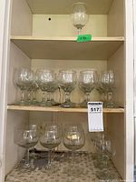 Shelved wine glasses showing quantity and style