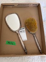 Mirror and brush full view showing size, form and sterling composition label