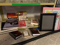 Group of books, two picture frames, two decorative book boxes