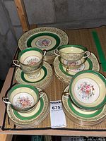 Overall lot with stacked plates and cream soup bowls