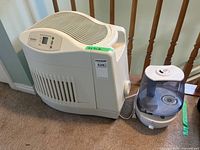 Kenmore and Westinghouse humidifiers side by side